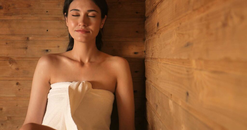 woman sitting in a sauna 